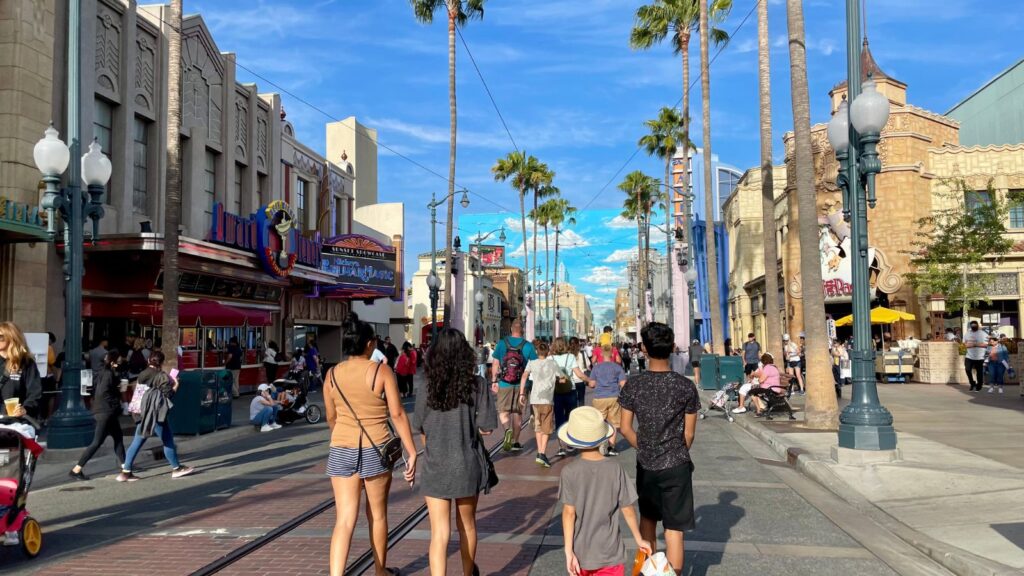 People walking through Disney's California Adventure theme park in Anaheim on a sunny day