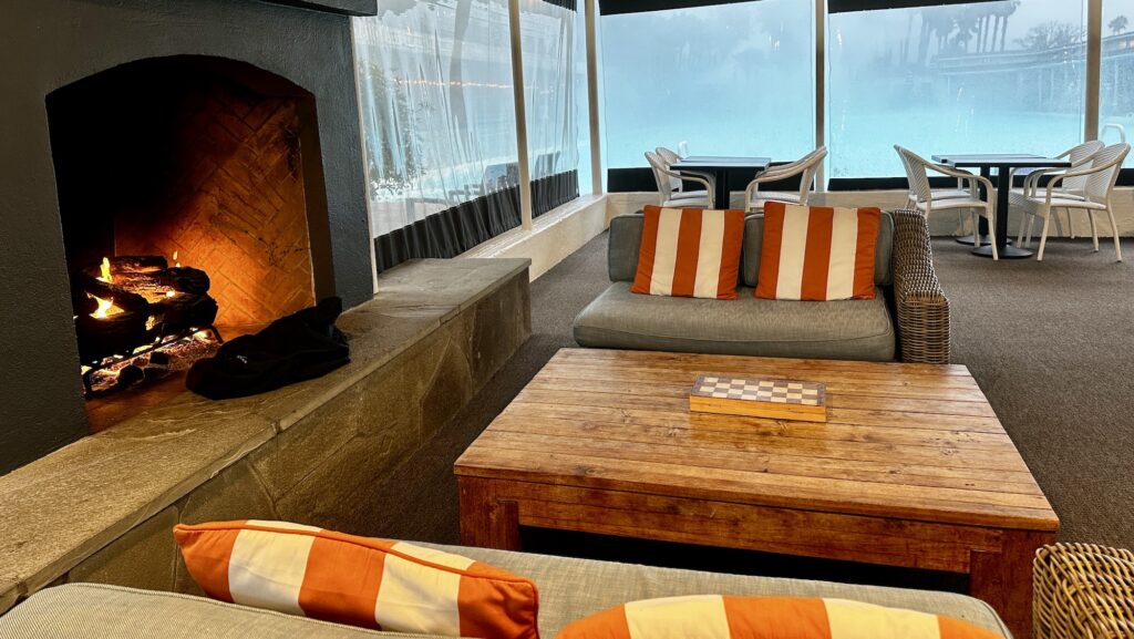 hangout area by the pool with fireplace at Indian Springs