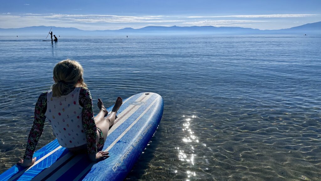 paddleboarder relaxing on Lake Tahoe
