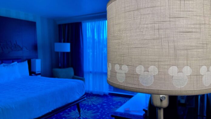 Disneyland Hotel lamp with bed in background